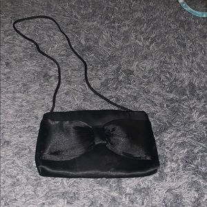 Black purse with bow